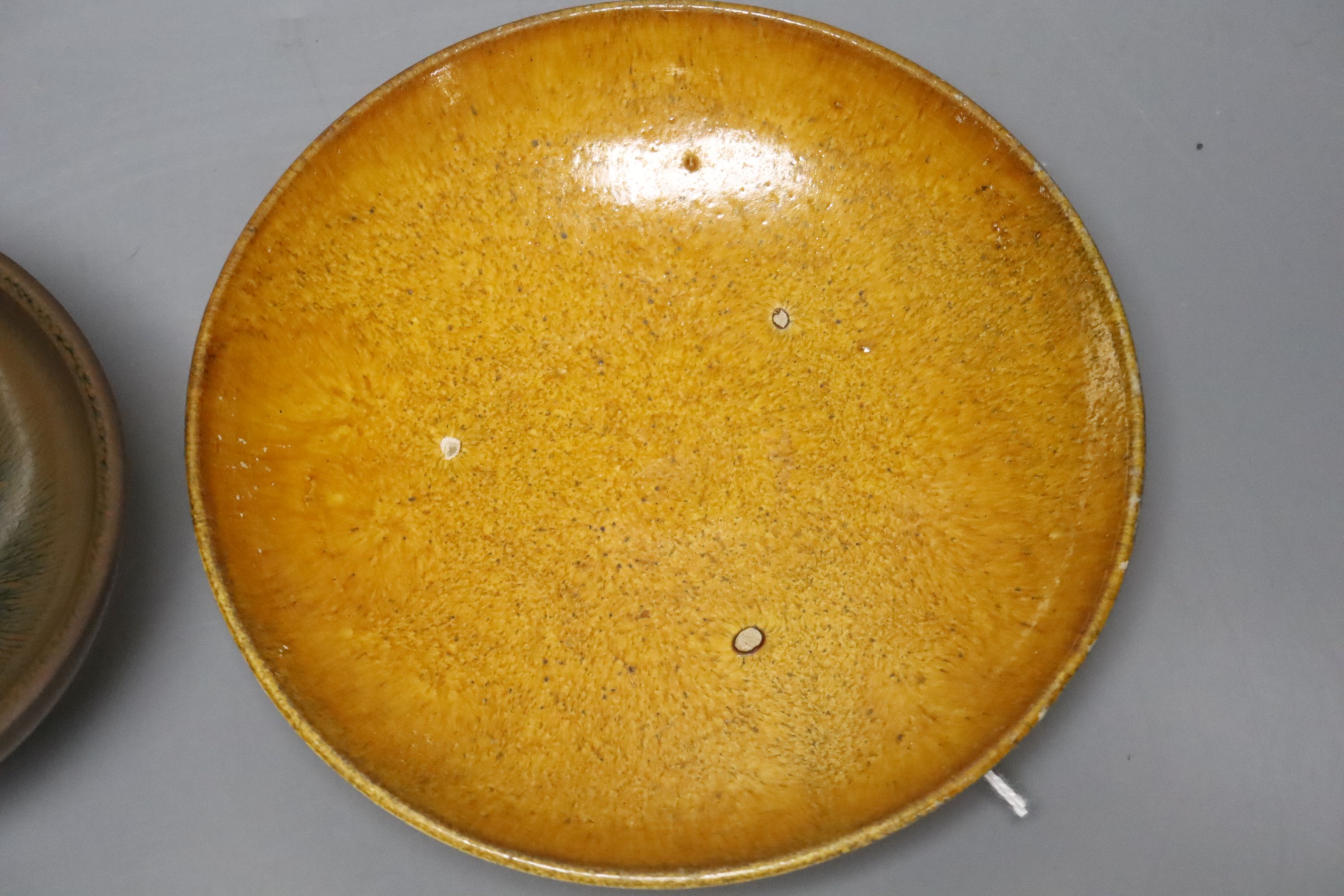 A Chinese amber-glazed pottery dish, Liao dynasty: and a jianyao hares fur teabowl, possibly Southern Song